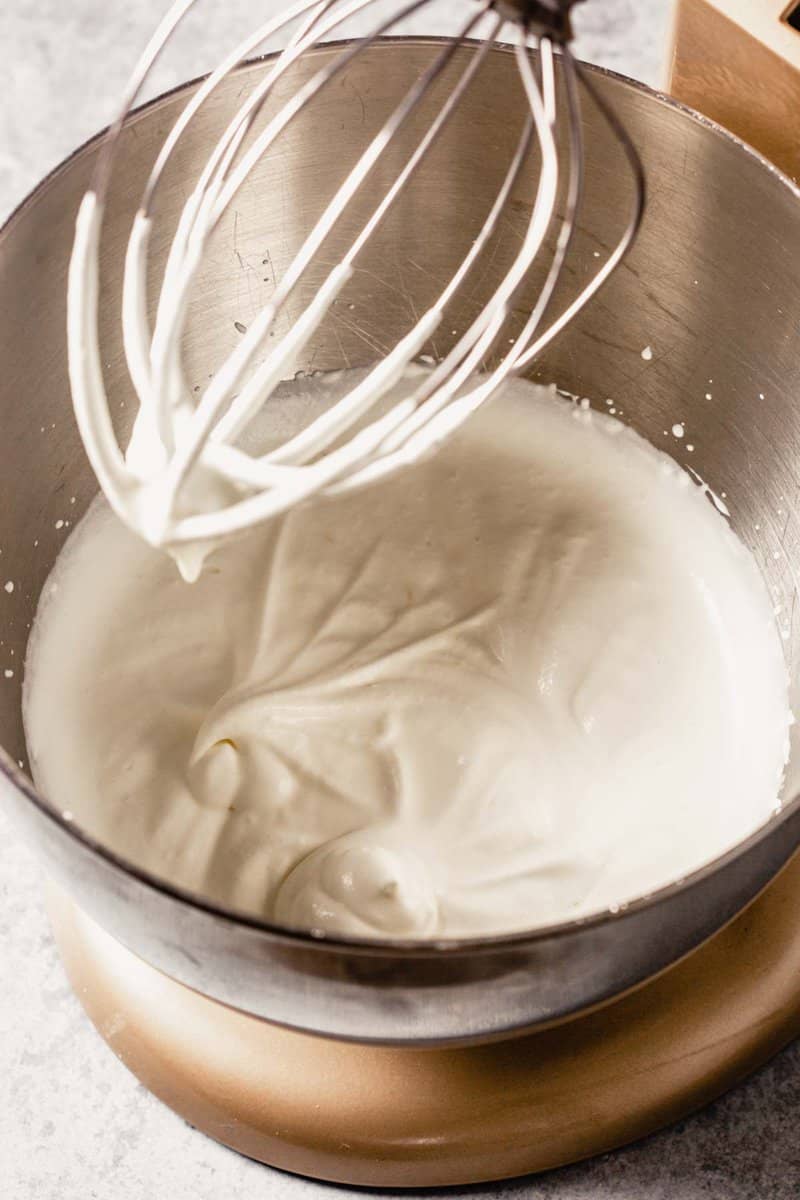 whipped cream in a stand mixer with whisk attachment