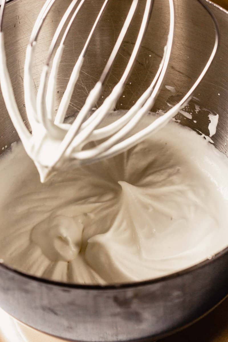 whipped cream in a stand mixer with whisk attachment