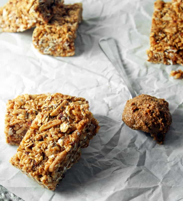 Photograph of almond butter granola bars on white paper