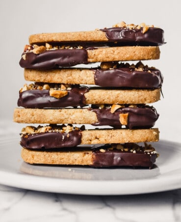 Photograph of shortbread cookies stacked on top of each other on a gray plate