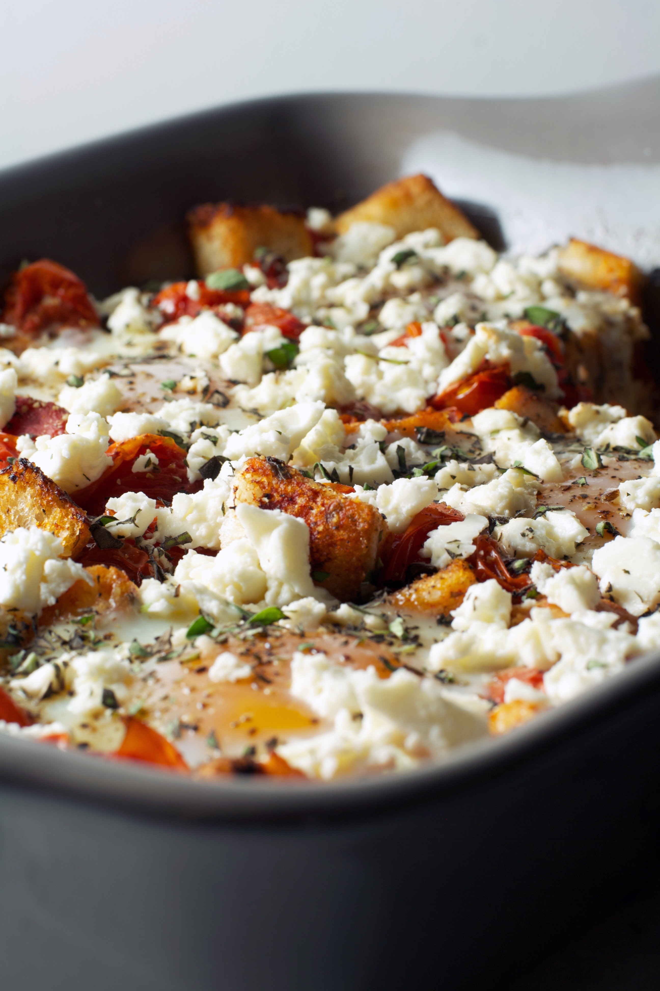 Baked Eggs with Tomatoes, Feta, and Croutons | Zestful Kitchen