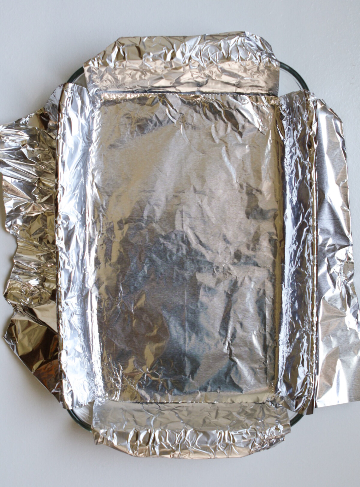 photograph of a foil-lined baking dish
