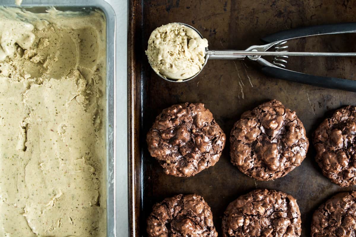 Vegan mint ice cream and flourless chocolate cookies on a sheet pan