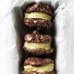 Photo of mint chocolate ice cream sandwiches in a loaf pan with white parchment paper