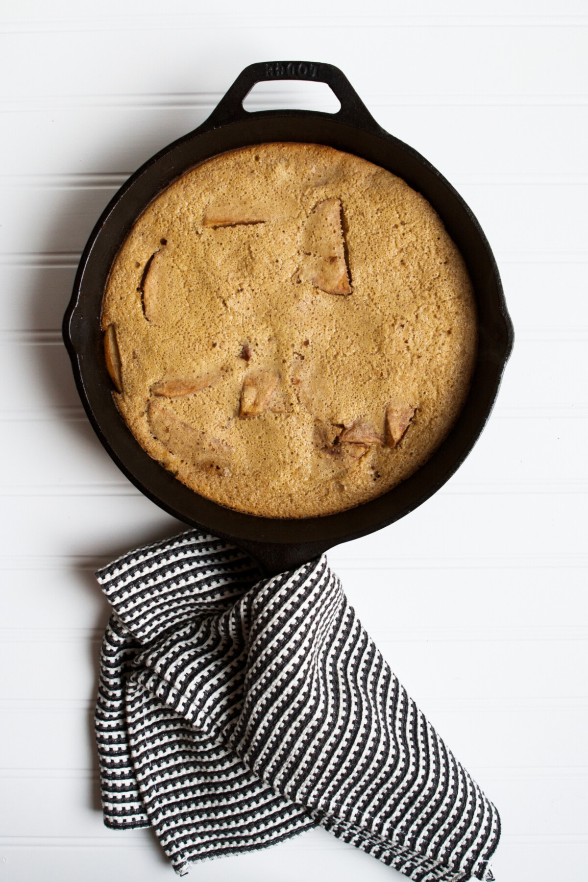 Photograph of puffed pancake in a cast iron skillet