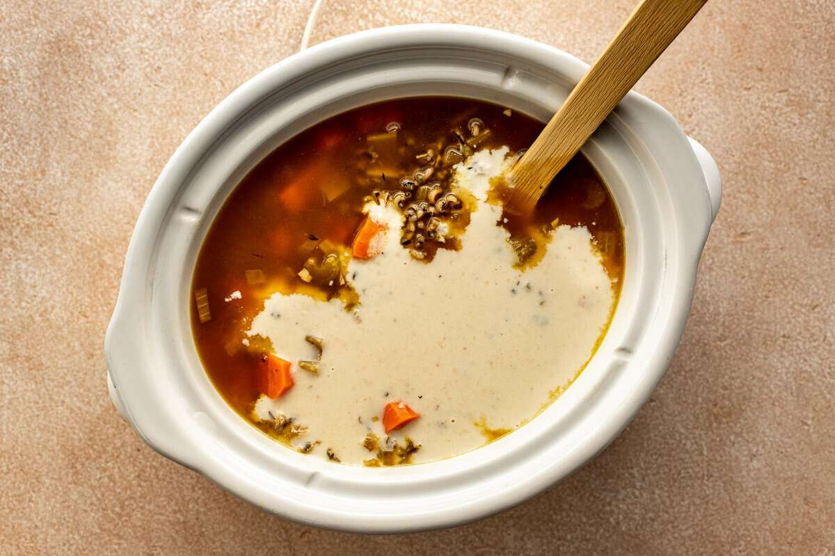 roux poured into a stock-based soup in a slow cooker