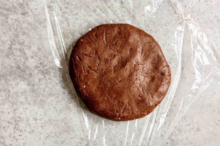 chocolate cookie dough on a piece of plastic wrap