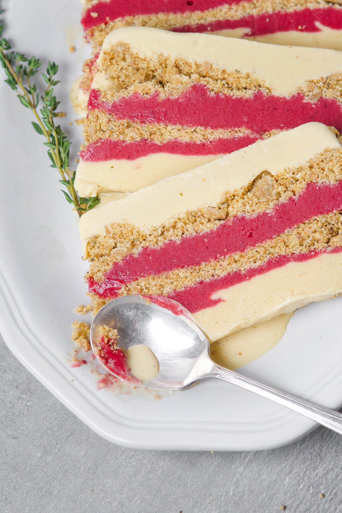 A wonderfully festive, and easy-to-make dessert, this layered ice cream cake featuring creamy goat milk ice cream, naturally sweetened cranberry curd, and a nutty biscotti layer, is most definitely one for the books. | from Lauren Grant of Zestful Kitchen