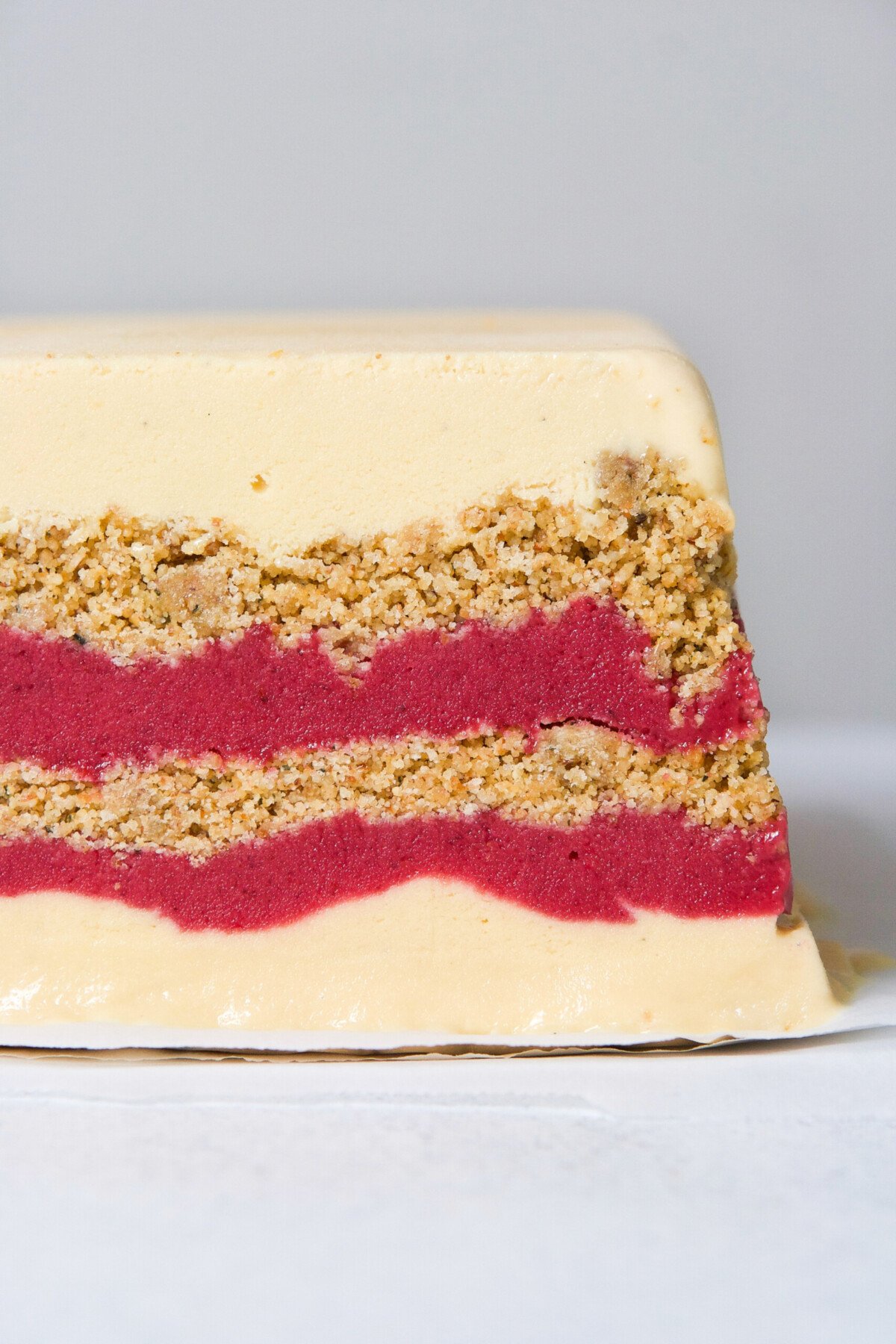 A wonderfully festive, and easy-to-make dessert, this layered ice cream cake featuring creamy goat milk ice cream, naturally sweetened cranberry curd, and a nutty biscotti layer, is most definitely one for the books. | from Lauren Grant of Zestful Kitchen