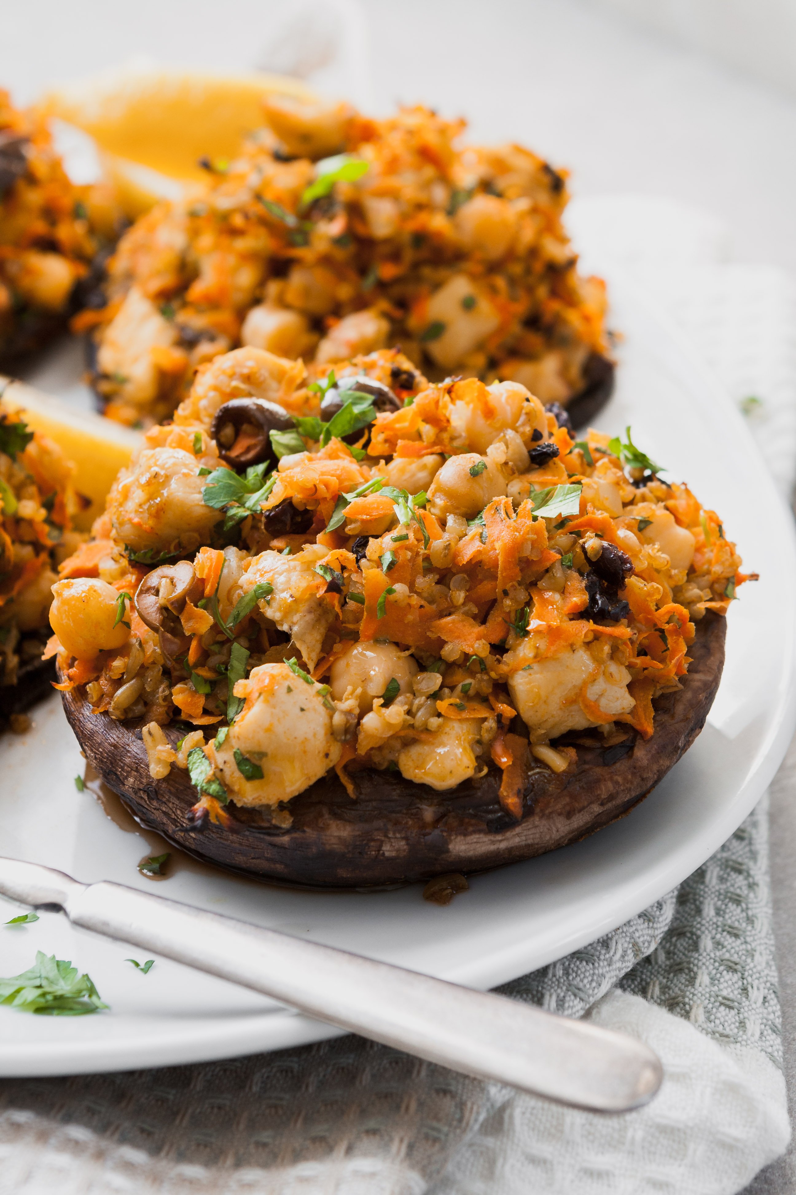 Packed with bold flavors and textures, these Moroccan Stuffed Portobellos with carrots, chickpeas, and ancient grains are not only healthy and satisfying, but easy to make and come together in under an hour! | from Lauren Grant of Zestful Kitchen
