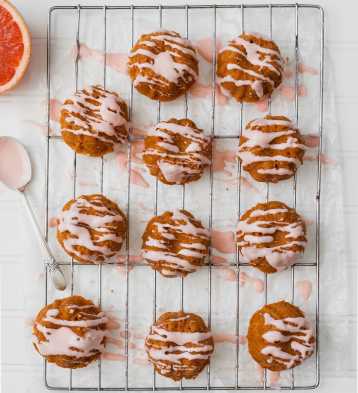 Tender tea cakes flavored with fresh grapefruit and Campari. These mini cakes are naturally sweetened with honey, easy to whip, and elegant enough for a fancy party. | from Lauren Grant of Zestful Kitchen