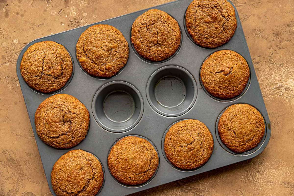 ten baked muffins in a muffin tin