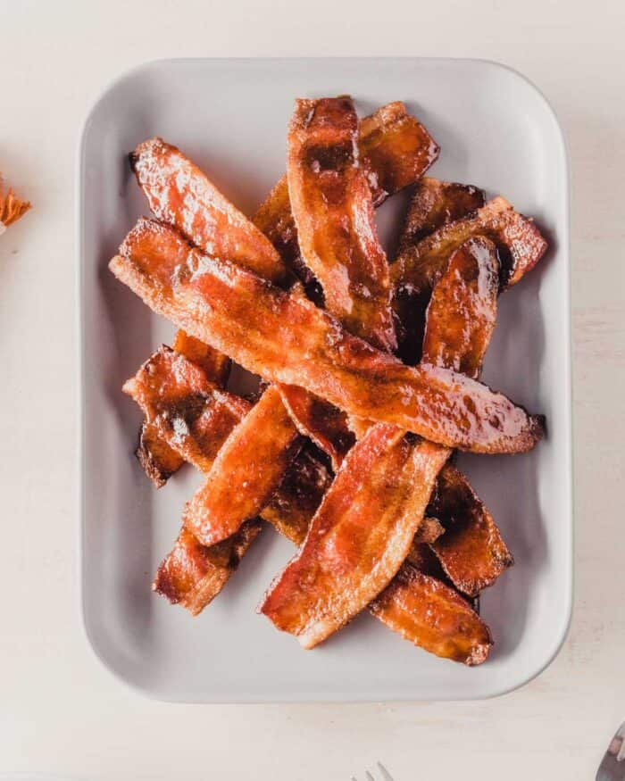 candied bacon on a gray plate