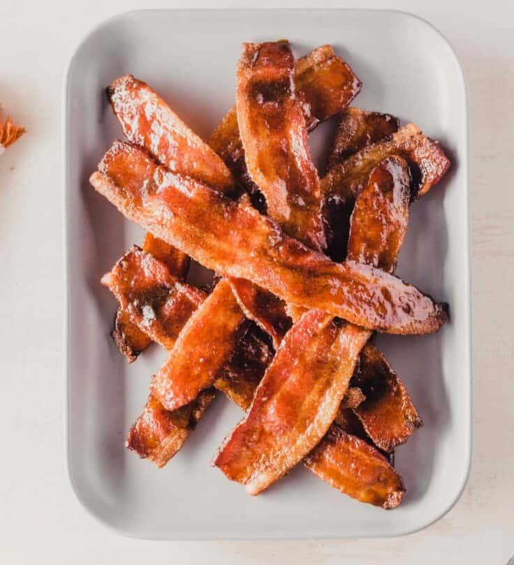 candied bacon on a gray plate