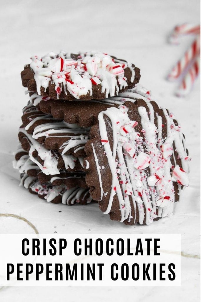 Chocolate peppermint cookies stacked on top of eachother on a white tissue paper