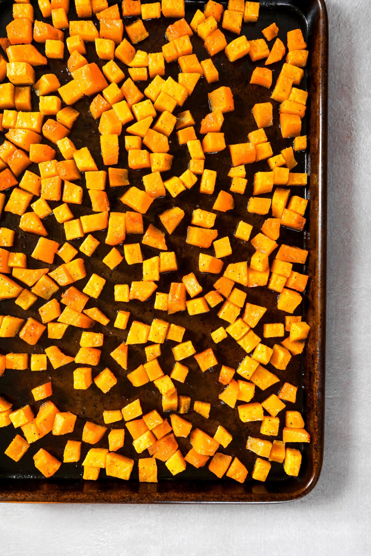 baking sheet with cubes of roasted squash