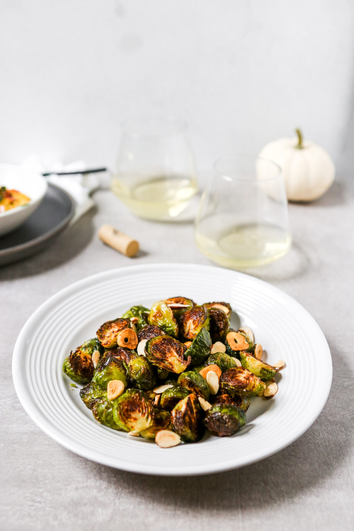 deeply roasted Brussels sprouts on a white plate. 