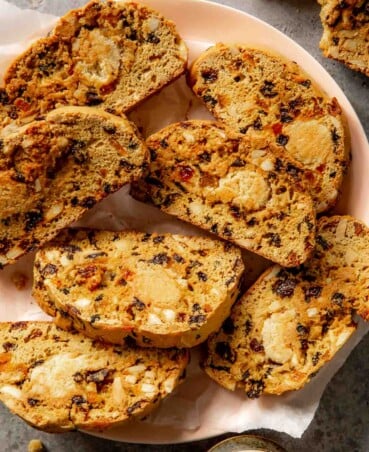 many biscotti on a parchment-lined plate