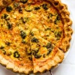 quiche recipe with a piece being pulled out