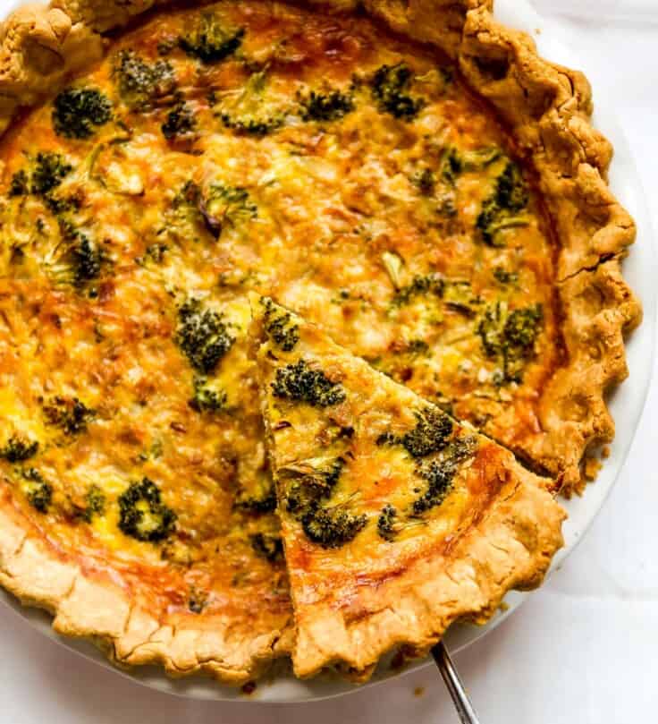 quiche recipe with a piece being pulled out