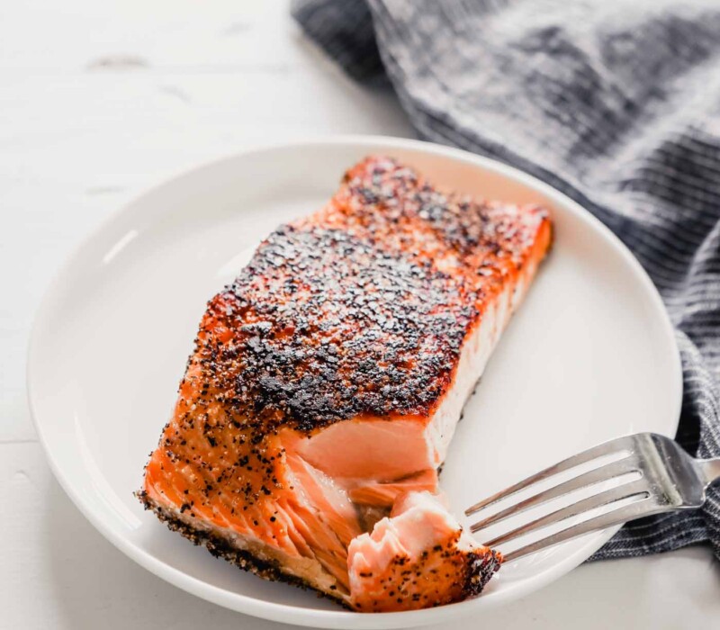 Close up photo of crispy pan seared salmon with a tender, moist interior