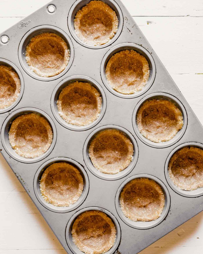 photo of dough-lined muffin tins
