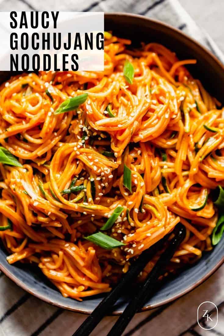 overhead photo of gochujang noodles with recipe title text overlay