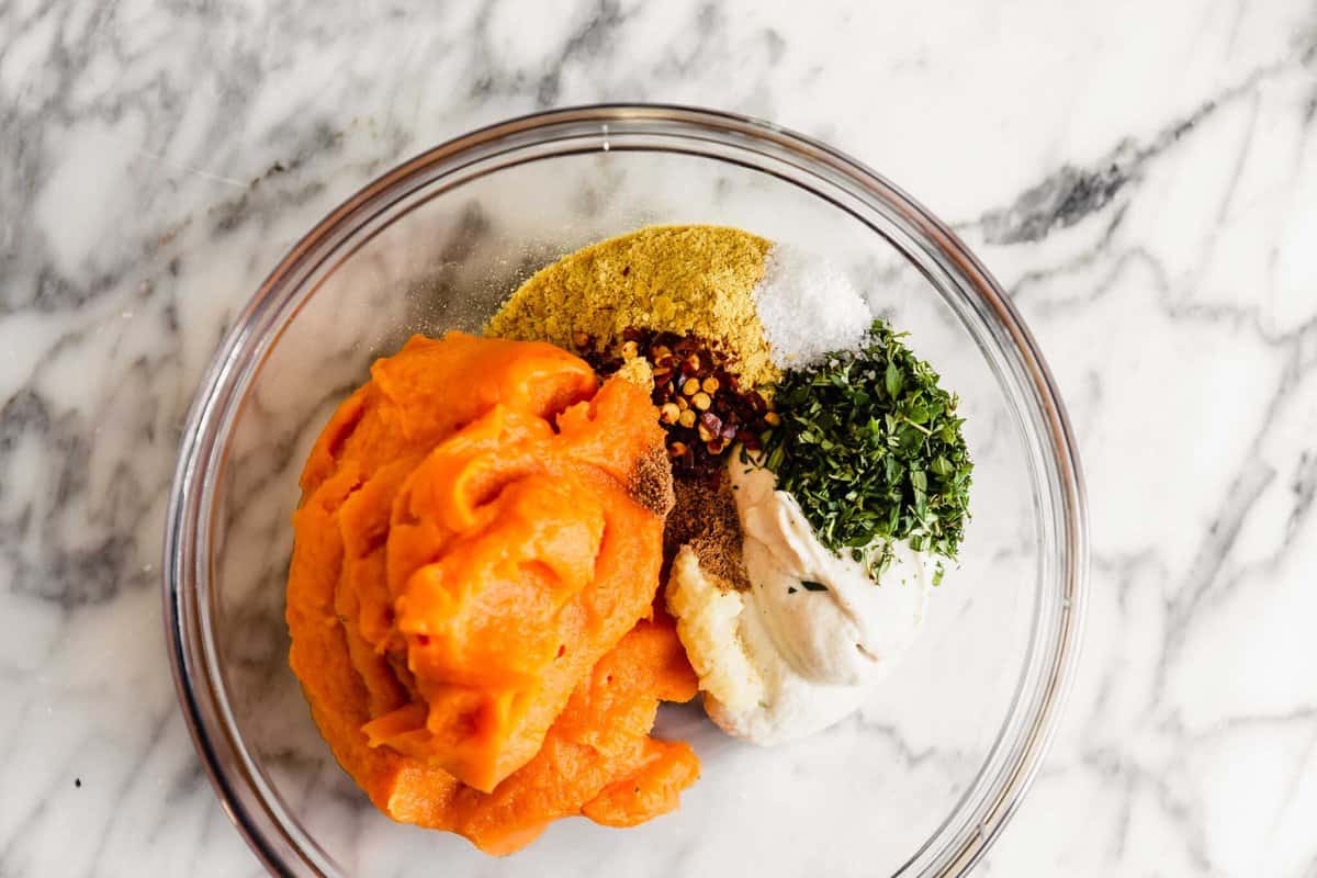 overhead image of vegan ravioli filling in a bowl (featuring sweet potato puree, cashew cream, herbs, nutritional yeast)