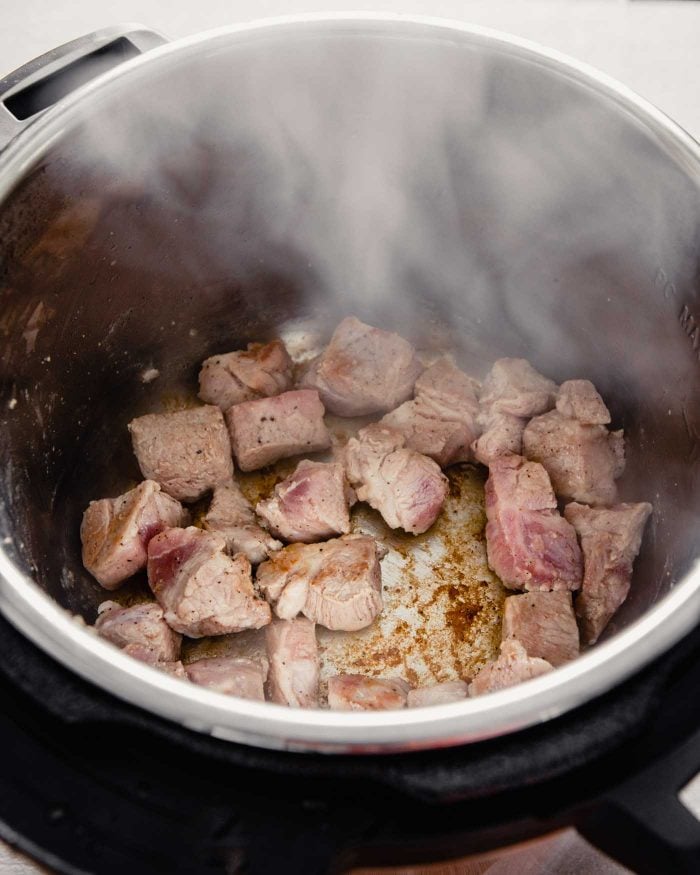 photo of pork being seared in an Instant Pot