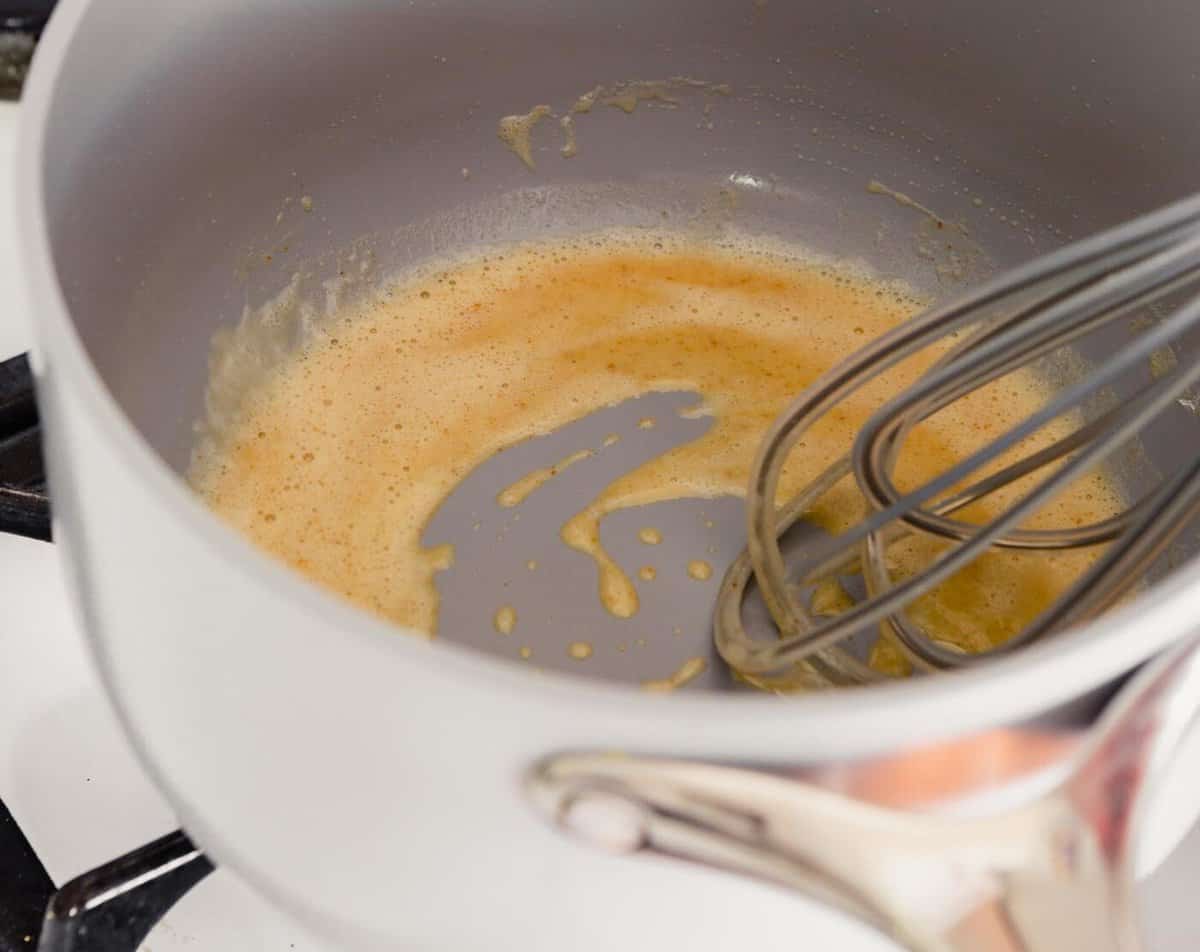 whisk whisking flour and butter in saucepan