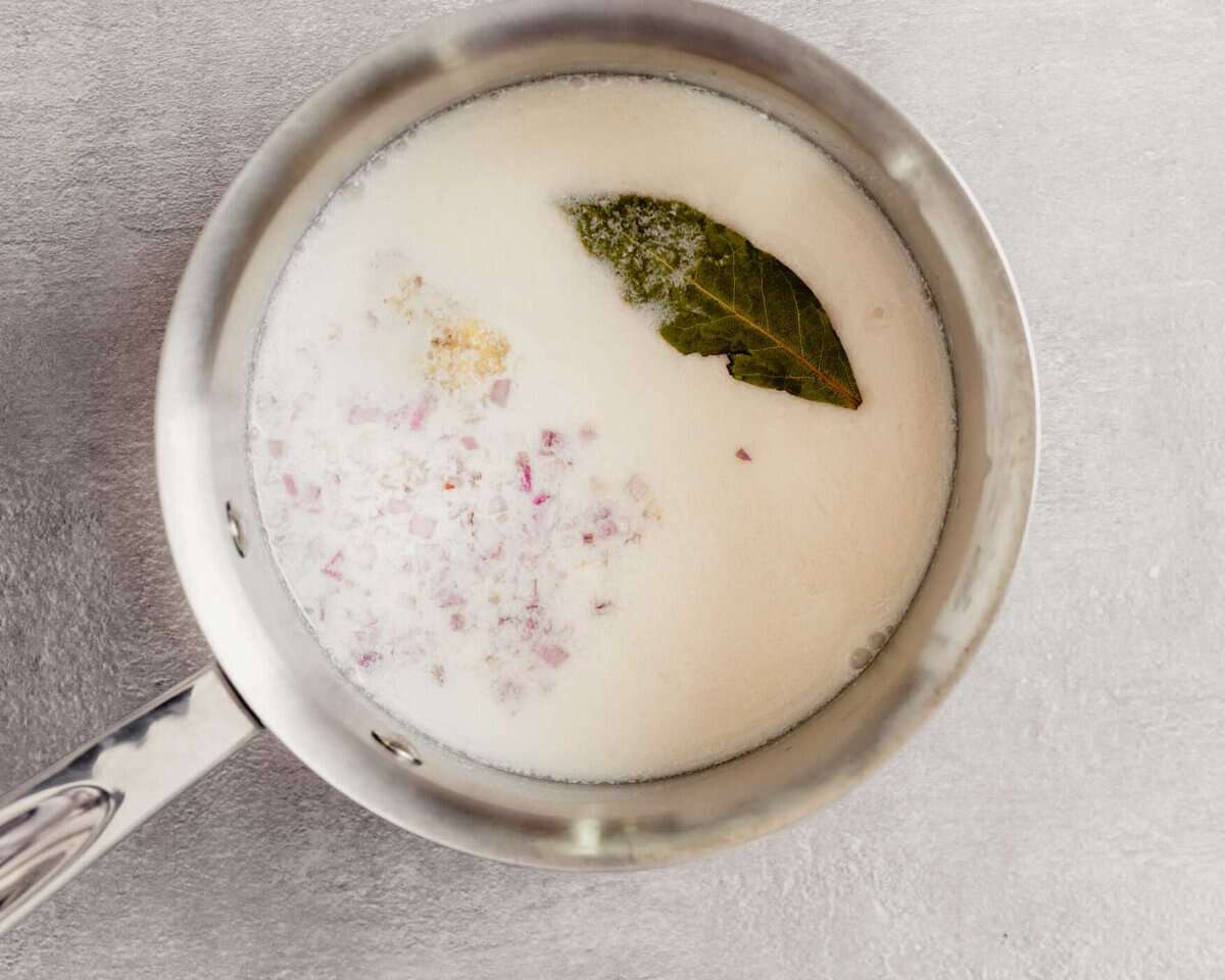 milk, bay leaf and shallot in a saucepan