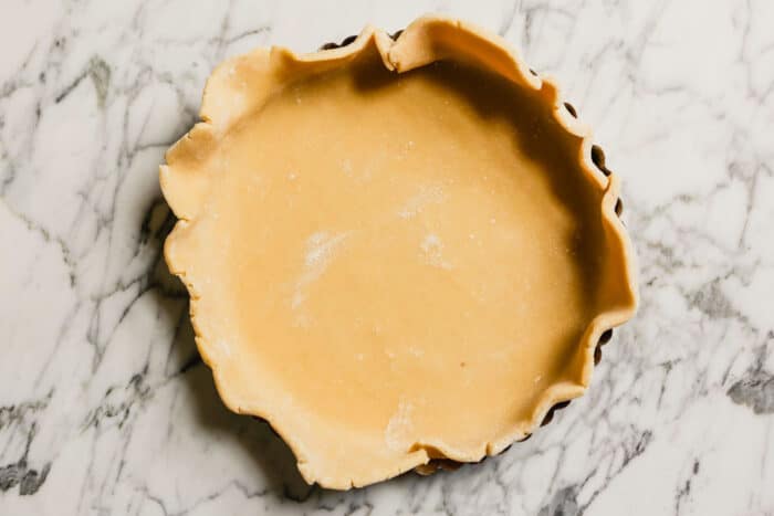 tart crust dough set inside a tart pan