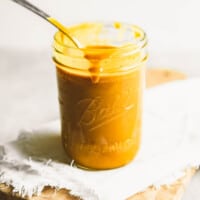 image of a jar filled with yellow barbecue sauce