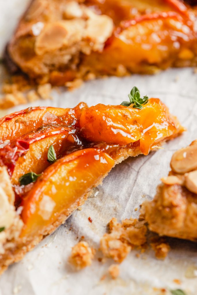 close up picture of the juicy peach filling of a peach galette
