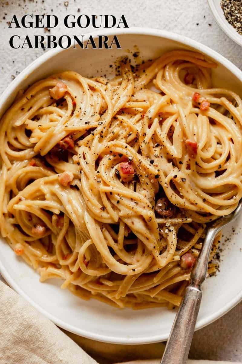 Overhead image of carbonara in a white bowl