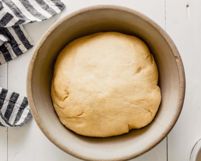 puffed dough in a medium sized bowl