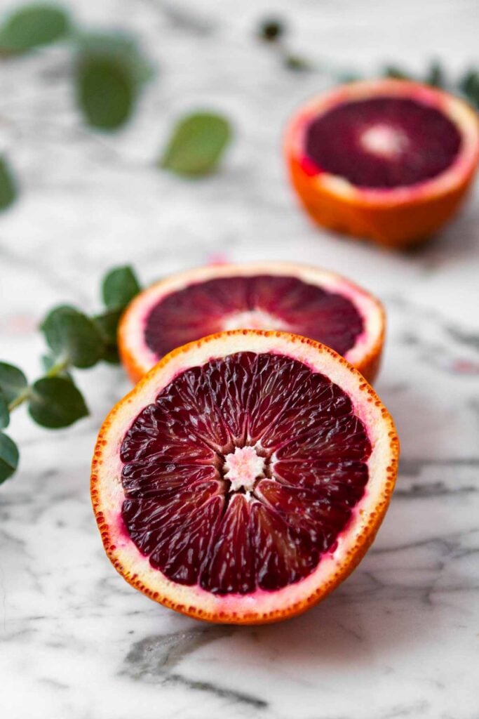 Blood oranges set on a marble table