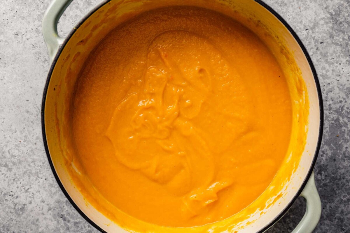 pureed curried carrot soup in a large pot
