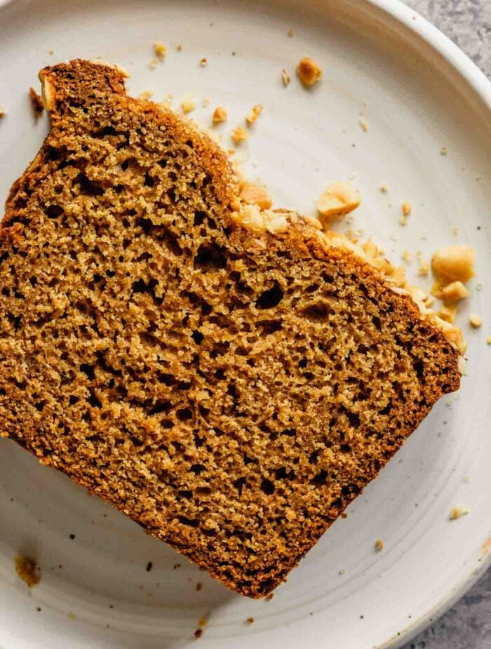 slice of peanut butter bread set on a white plate