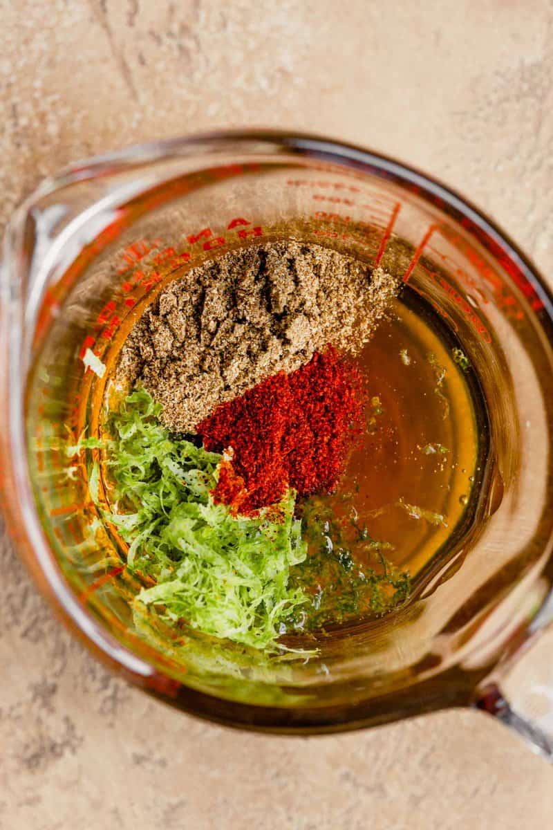 honey, lime zest, cayenne and coriander in a liquid measuring cup