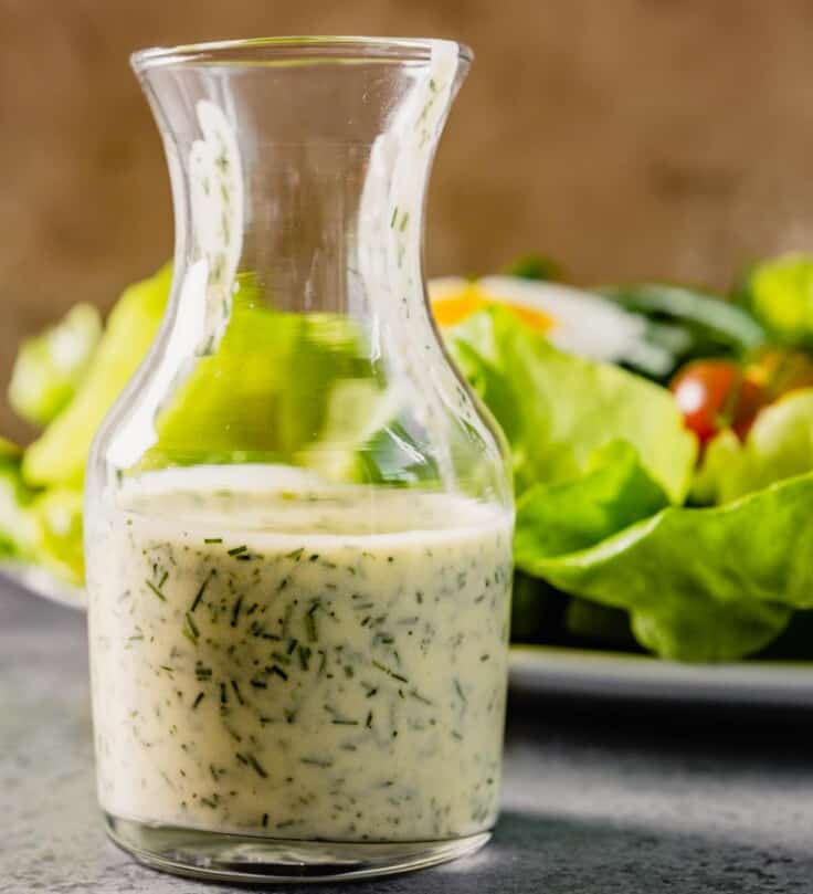 small glass vase filled with ranch dressing