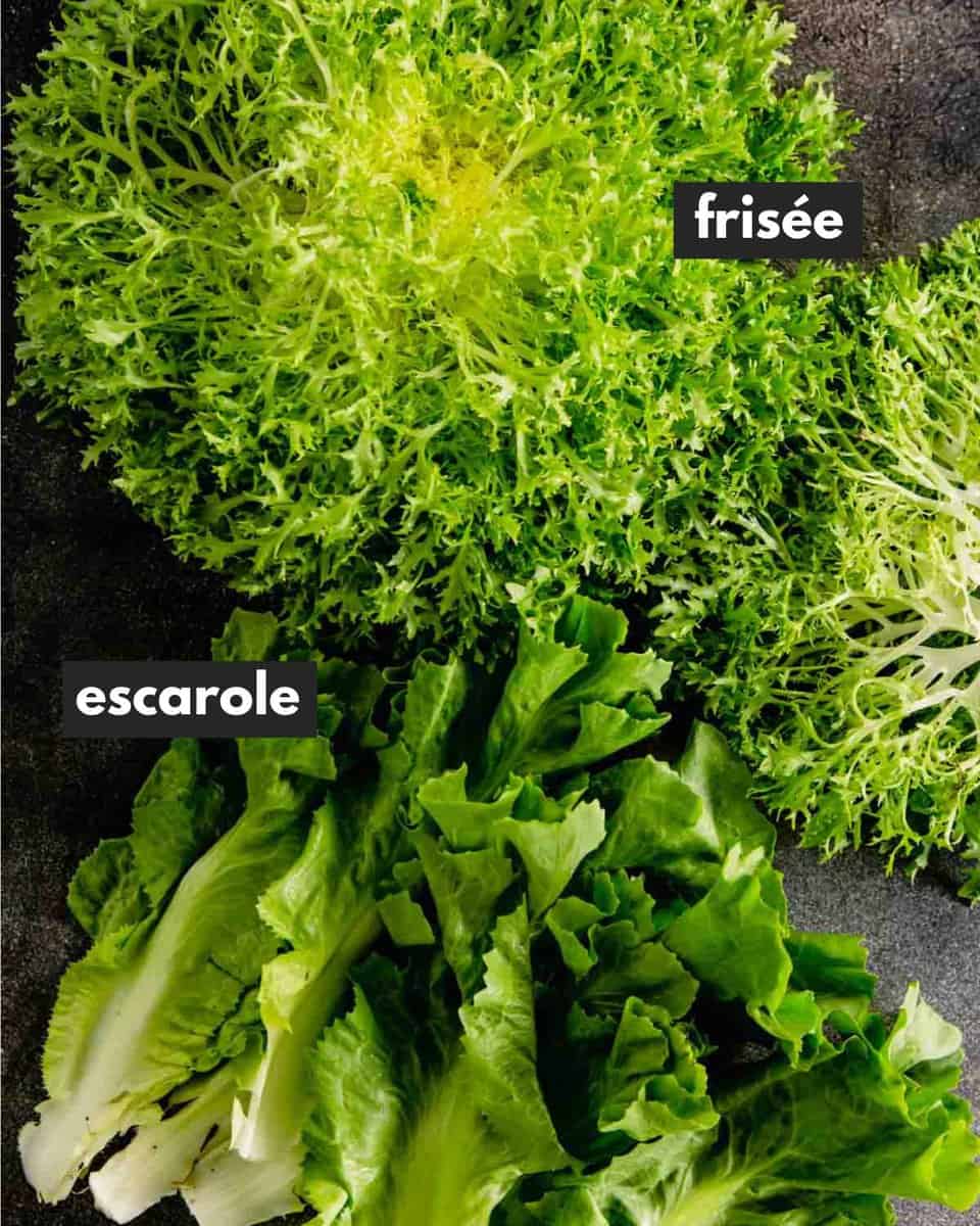 frissee and escarole set on a black table