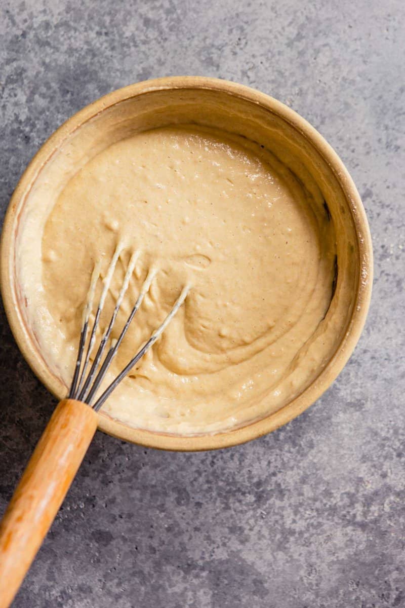 whole wheat pancakes batter in a light brown bowl