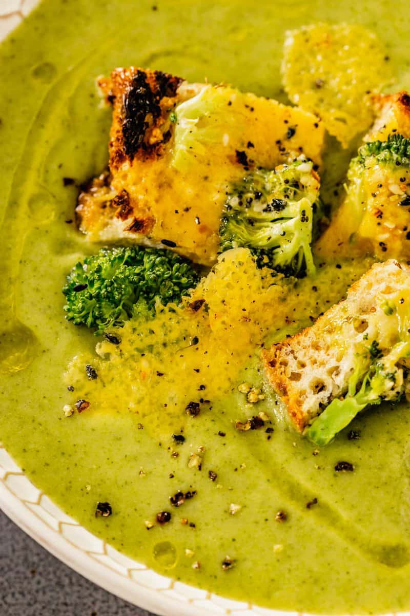 cheesy croutons set on top of smooth broccoli soup 