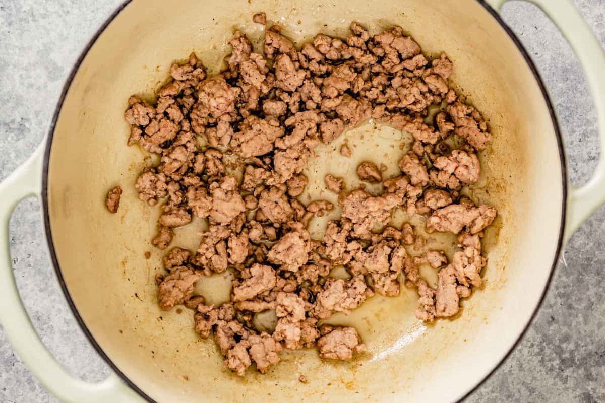 ground pork cooked in a dutch oven pot