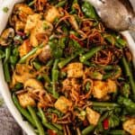 green beans, mushrooms, croutons, and fried onions in an oval white baking dish