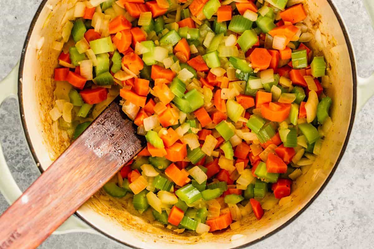 carrots, onions and celery diced and cooked in a large pot