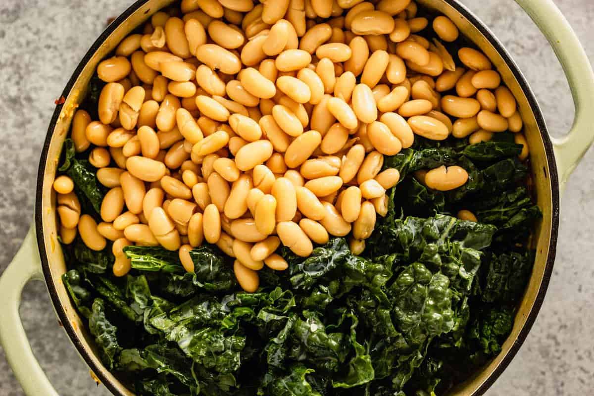 kale and white beans in a large Dutch oven