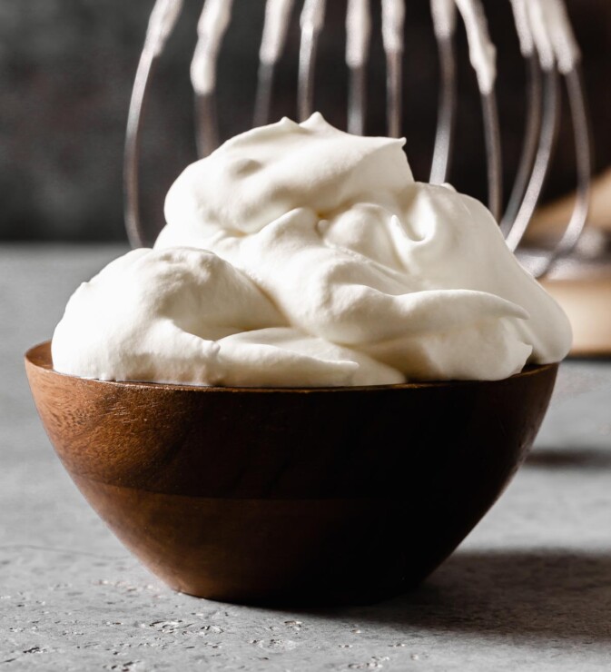 whipped cream in a small wooden bowl