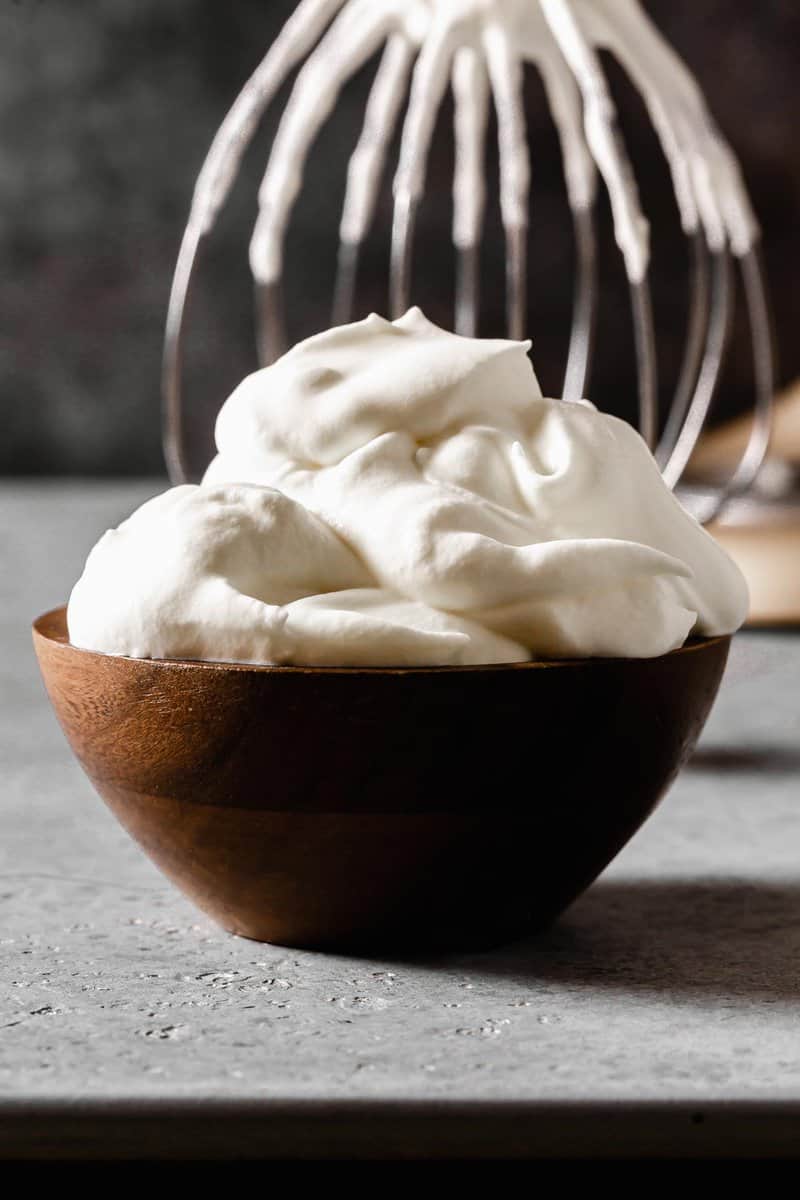 whipped cream in a small wooden bowl